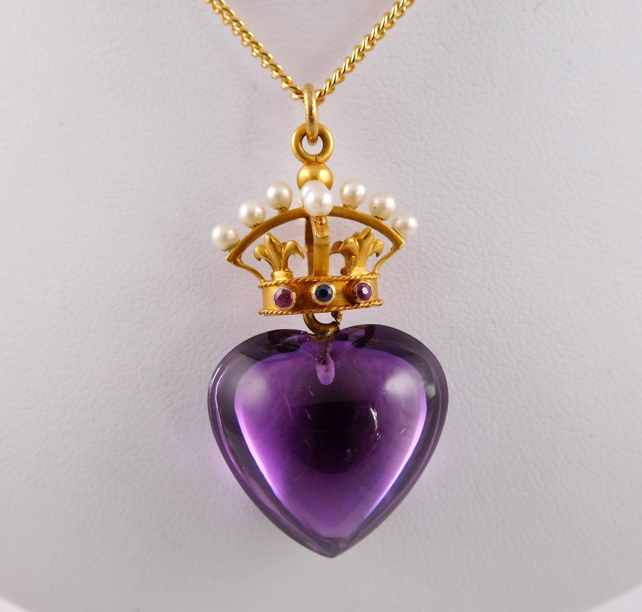 Sentimental amethyst heart pendant with gold crown detail