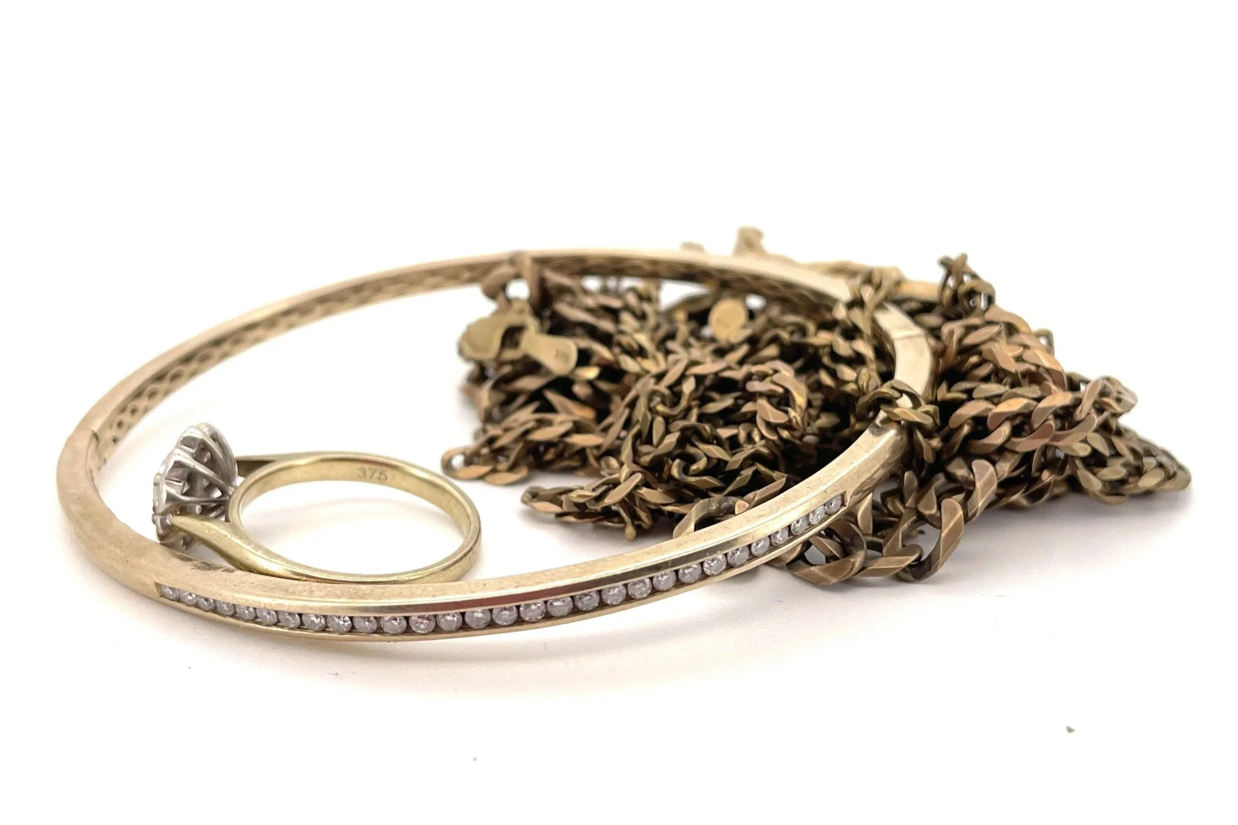 Before and after jewellery transformation from unworn gold and diamonds to a handmade gold snake cuff
