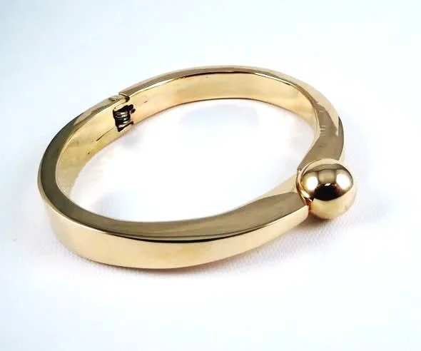 Handmade hinged bangle made from recycled gold