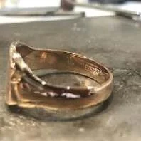 A close-up of a gold ring.