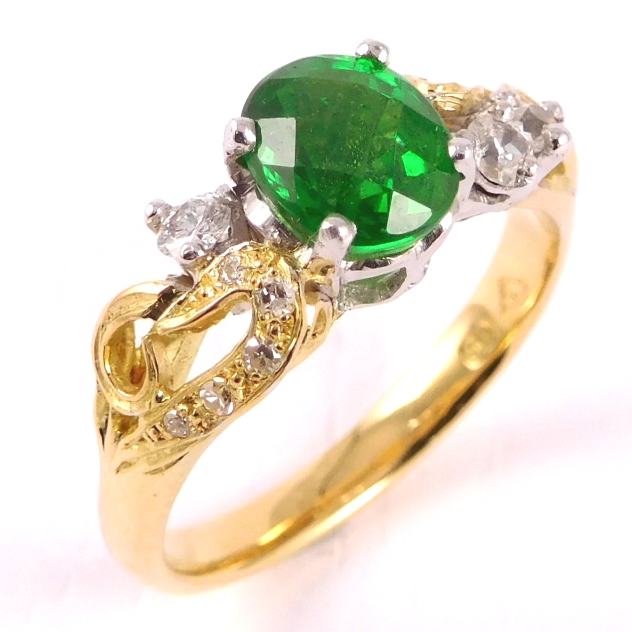 Inherited rings remodelled into a gold tsavorite and diamond ring