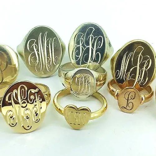 Collection of gold signet with intricate monogram engravings.