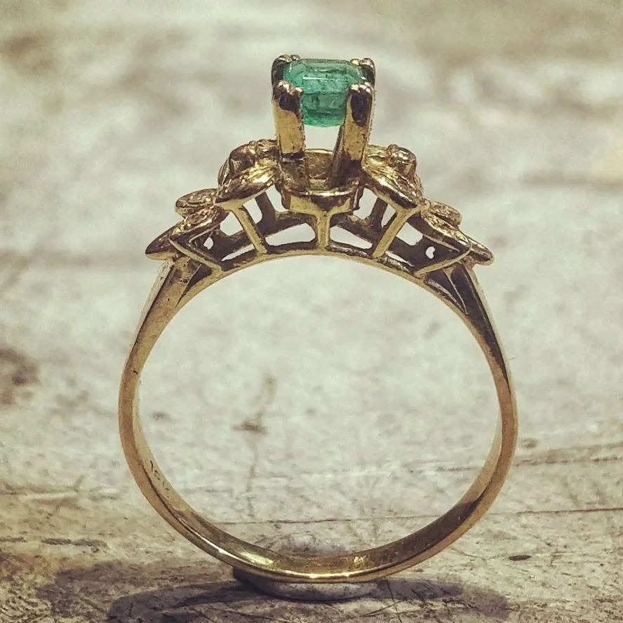 Emerald ring before the setting was lowered