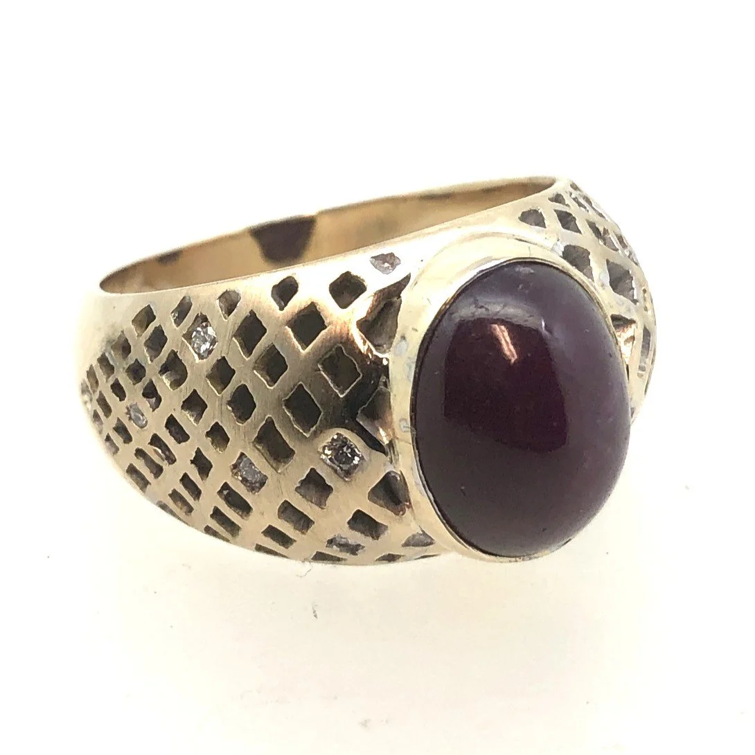 Finished hand-pierced yellow gold star ruby ring with diamond accents