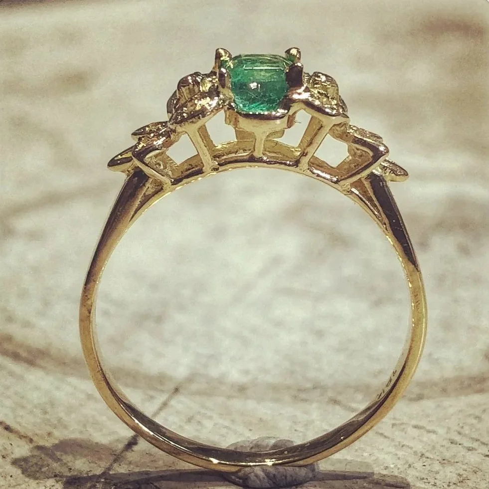 Emerald ring after the setting was lowered for improved wearability
