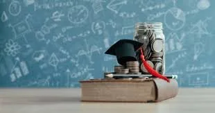Stack of books with a graduation cap on top, a rolled diploma tied with a red ribbon, and a pile of coins, with a chalkboard filled with educational doodles in the background.