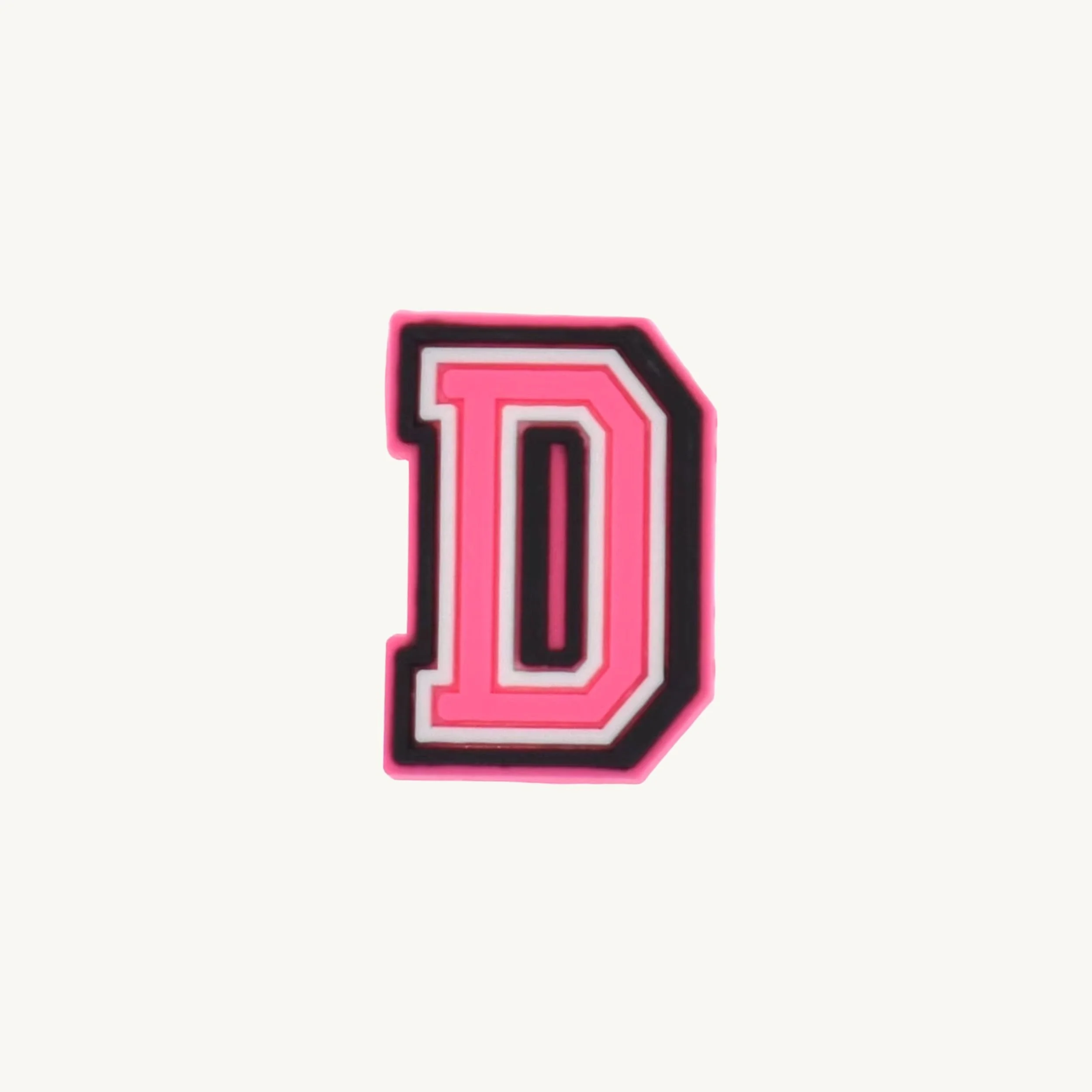 Pink varsity initial letter D charm by CharmyKidz for customizable hair accessories