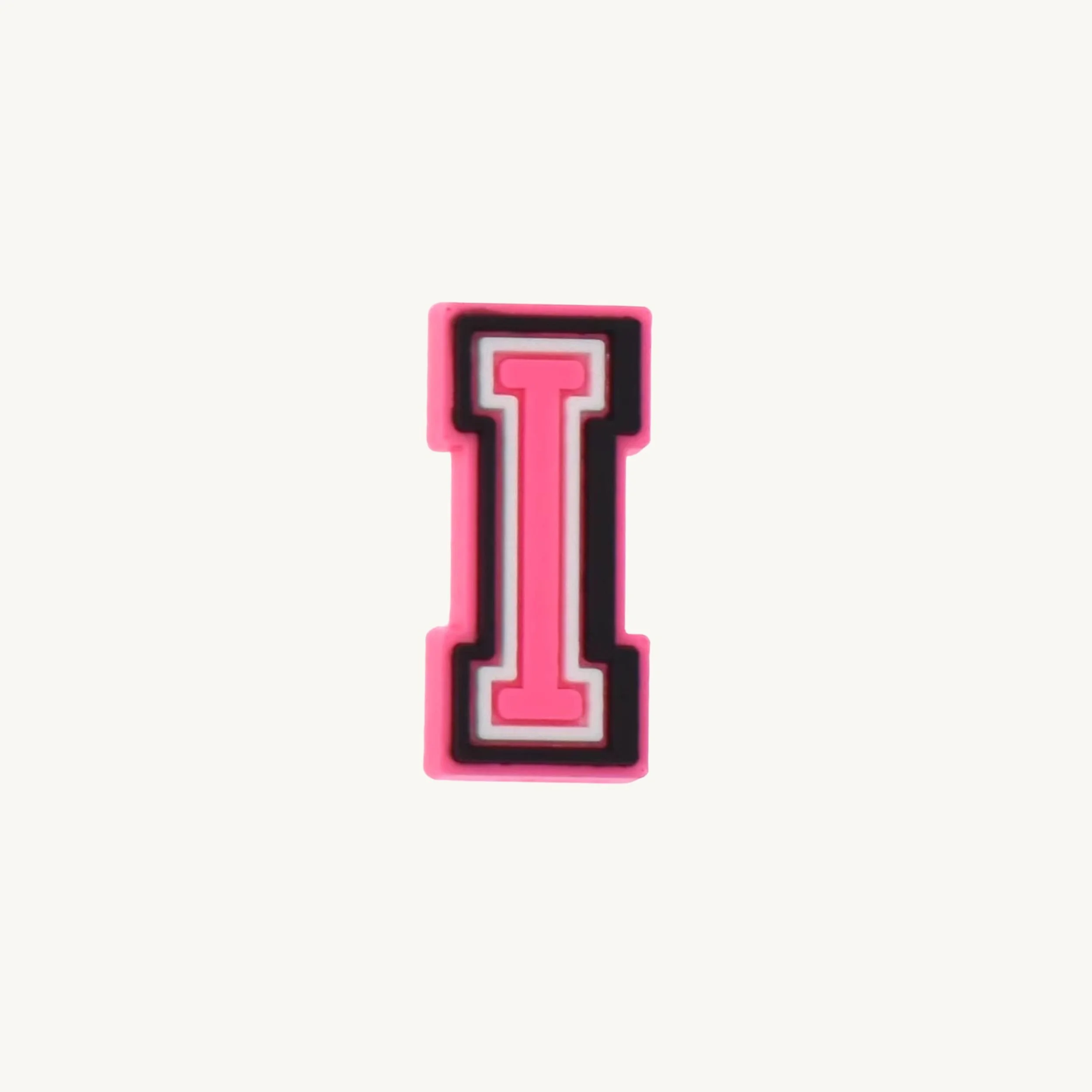 Pink varsity initial letter I charm by CharmyKidz for customizable hair accessories