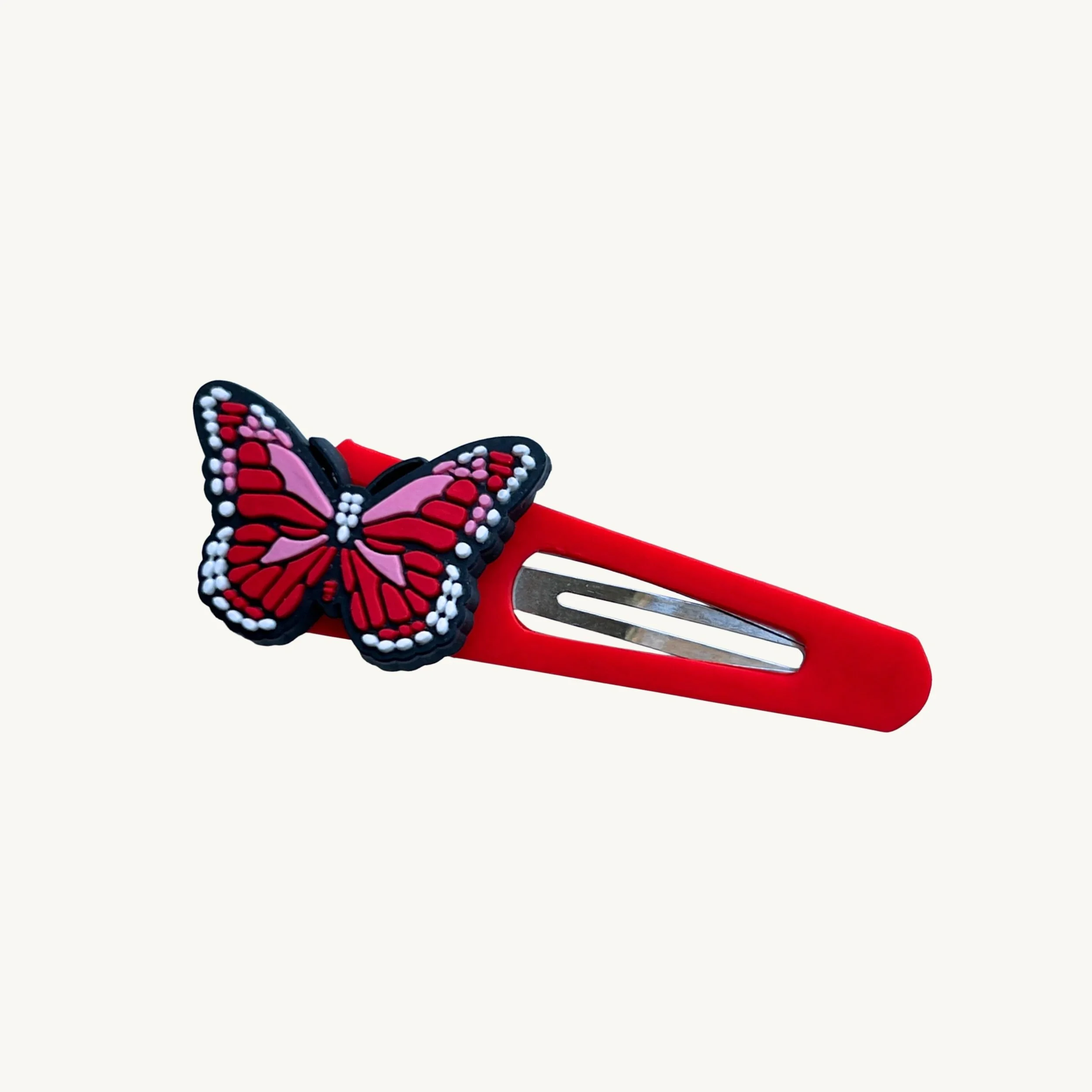 Red hair clip with pink butterfly charm by CharmyKidz for customizable hair accessories