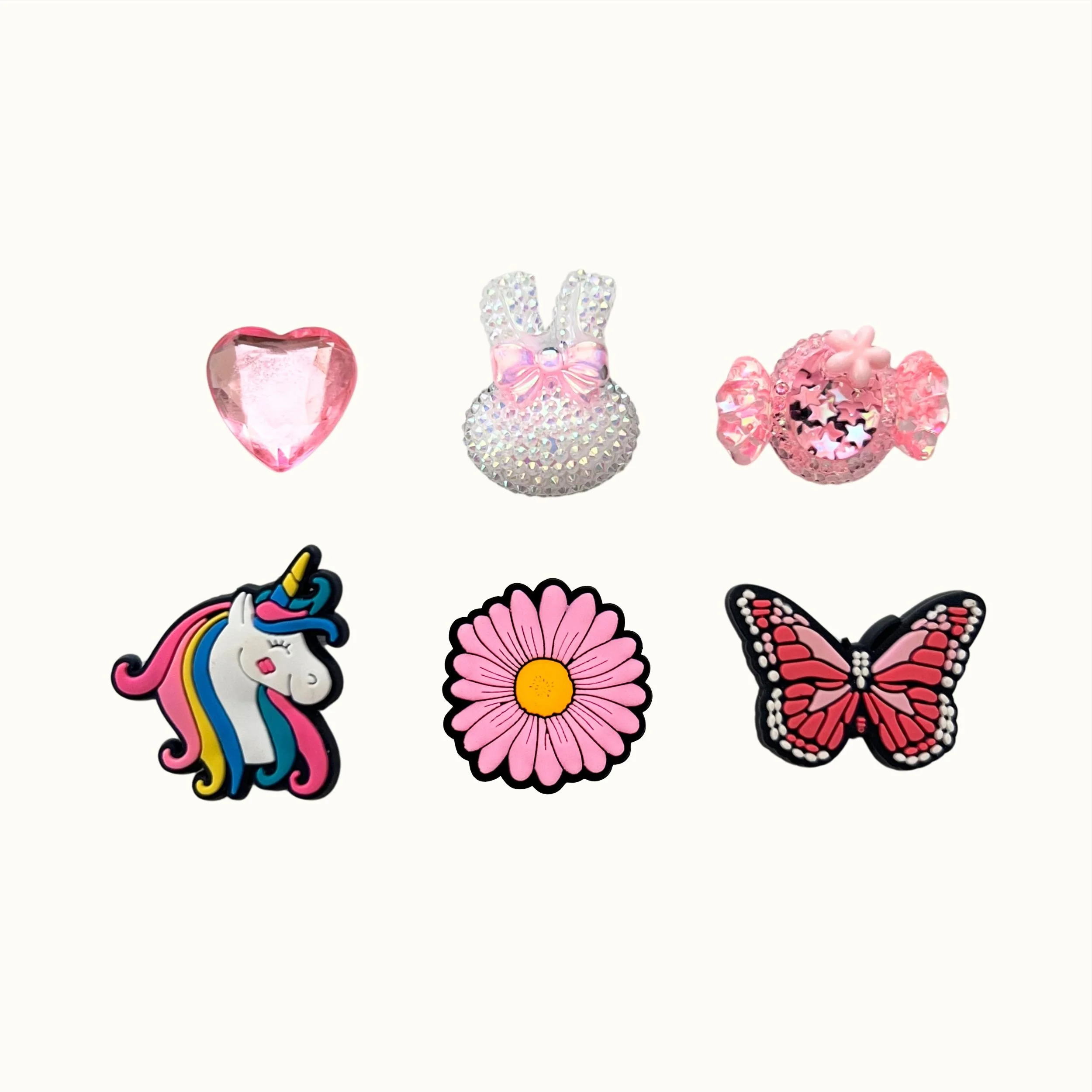 Pink gem heart, sparkle bunny, candy, unicorn, daisy, and butterfly 6-pack charm set by CharmyKidz for customizable hair accessories