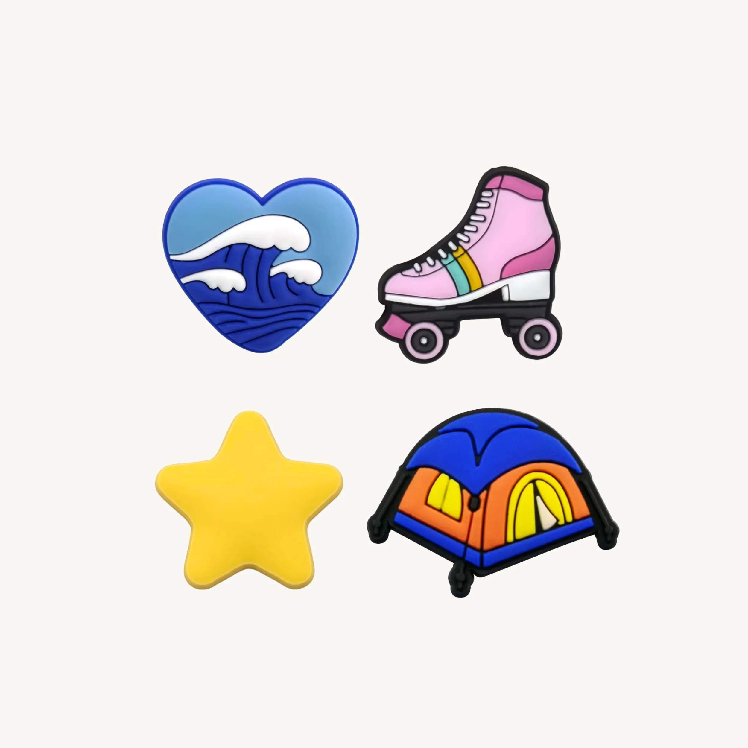 Ocean heart, pink roller skate, yellow star, and camping tent 4-pack charm set by CharmyKidz for customizable hair accessories