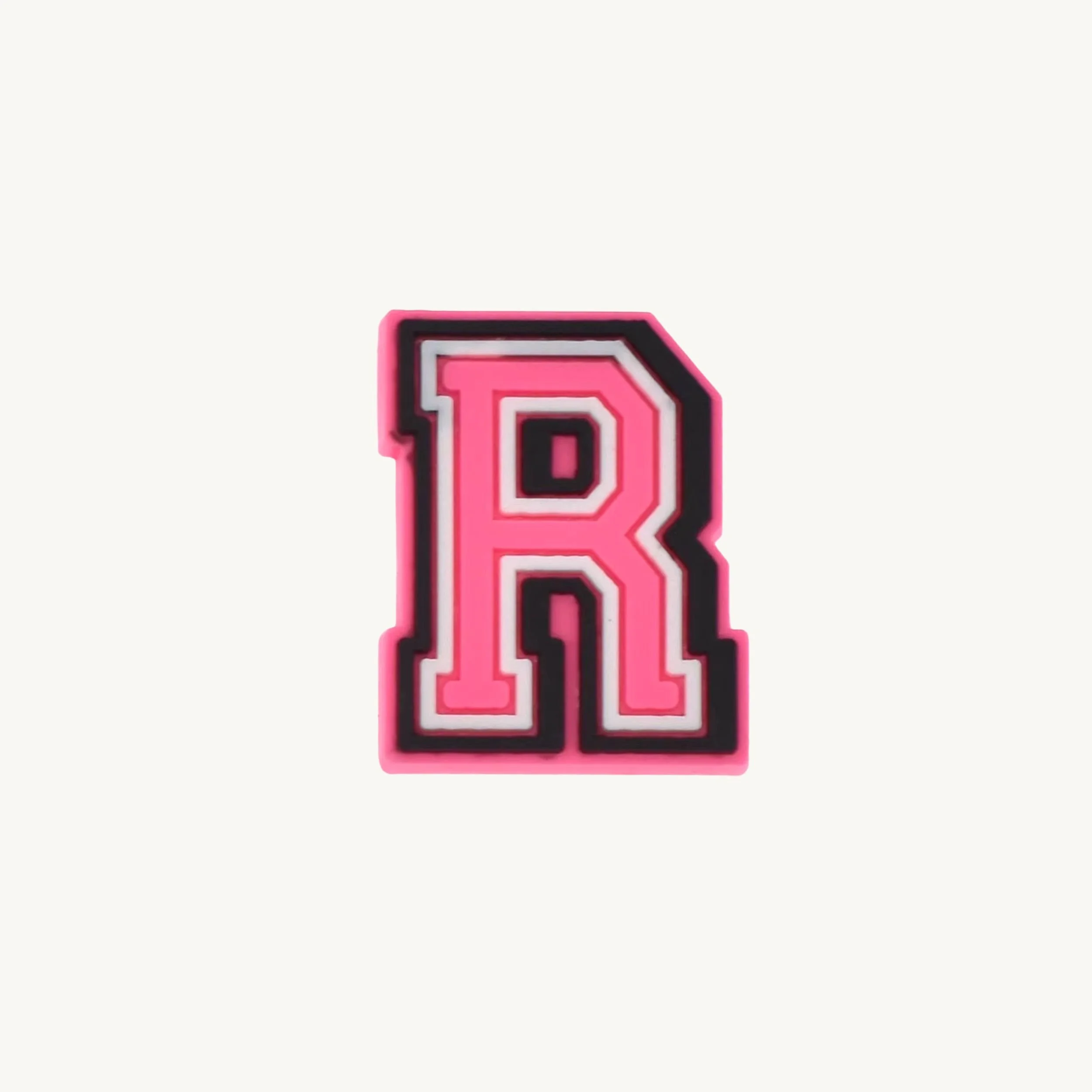 Pink varsity initial letter R charm by CharmyKidz for customizable hair accessories