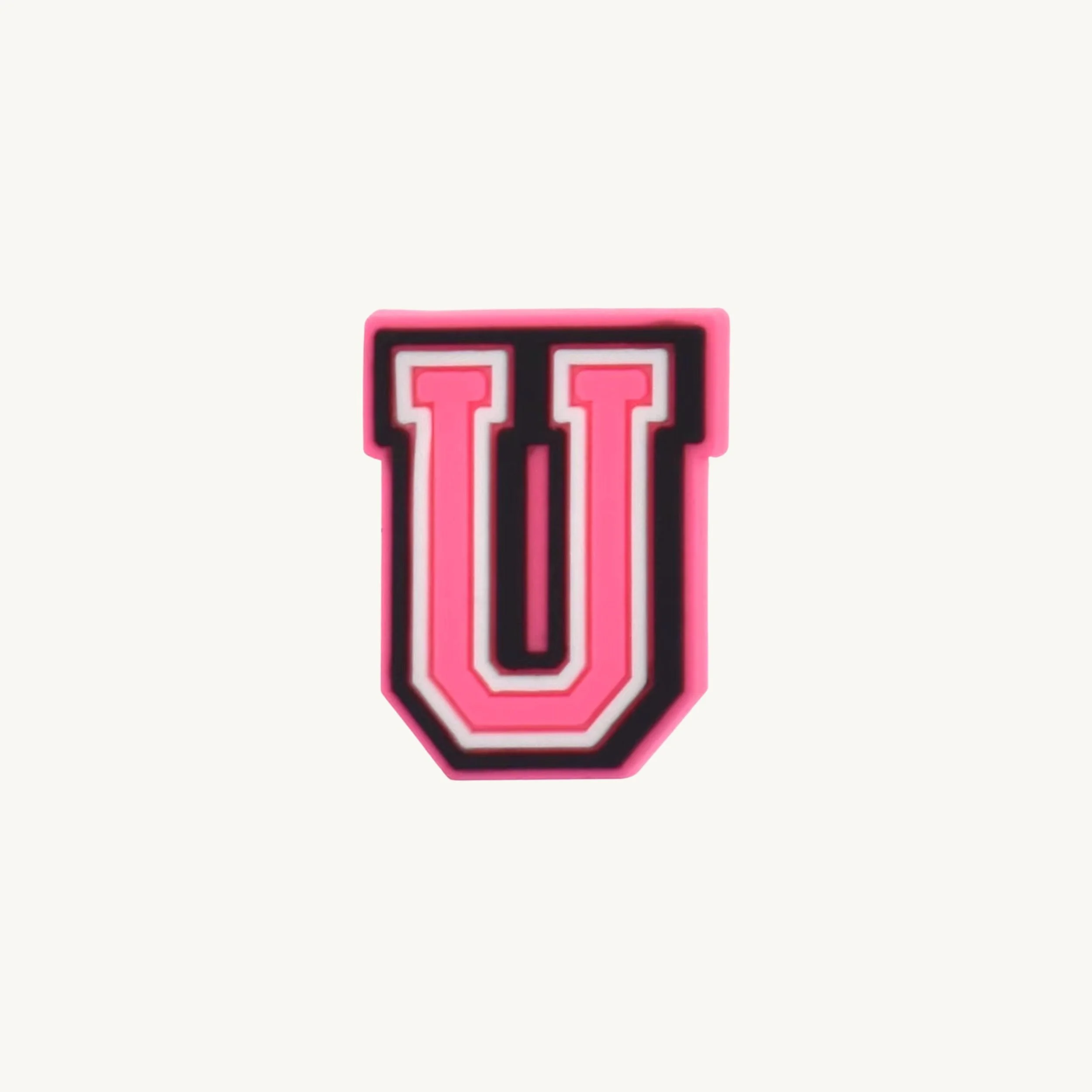 Pink varsity initial letter U charm by CharmyKidz for customizable hair accessories