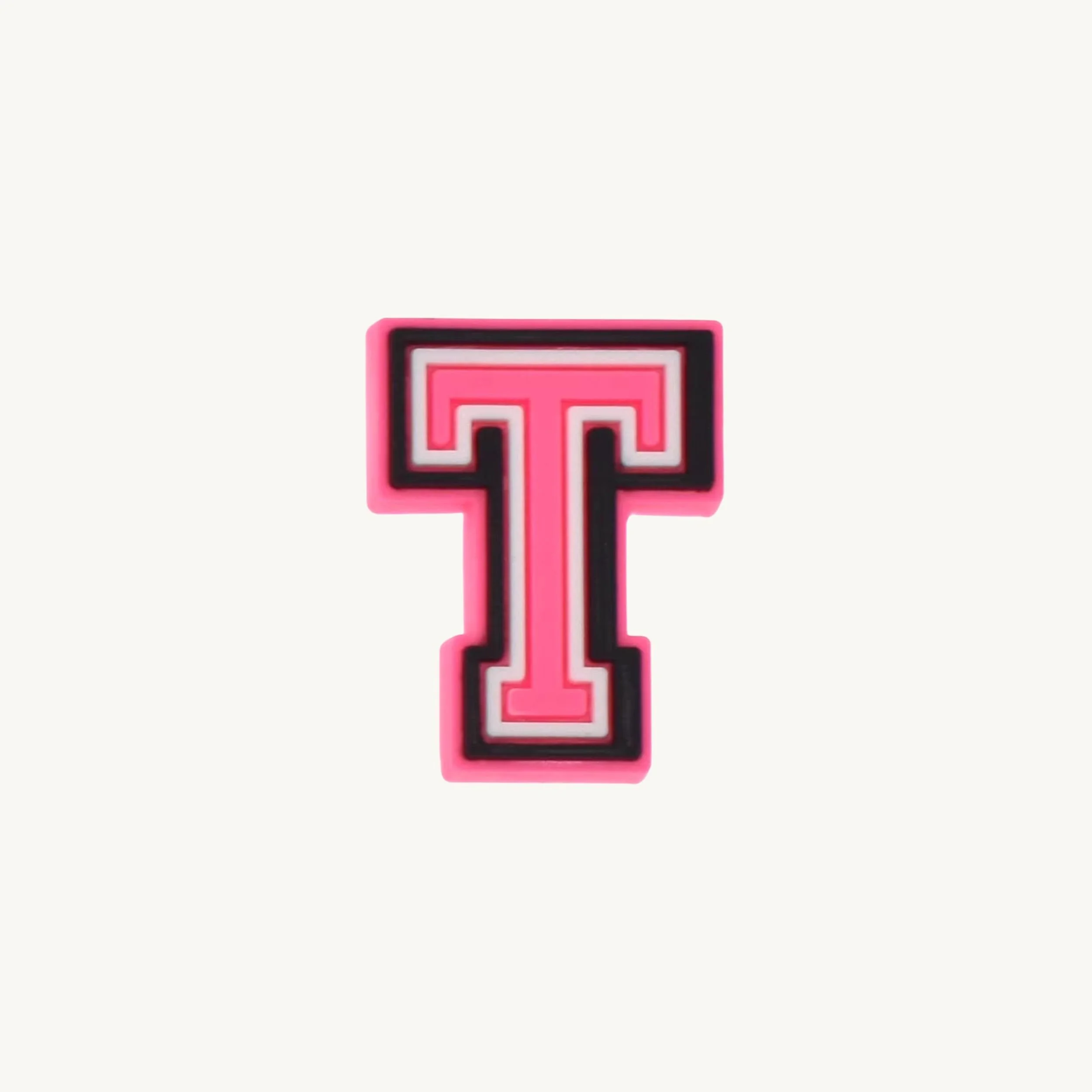 Pink varsity initial letter T charm by CharmyKidz for customizable hair accessories