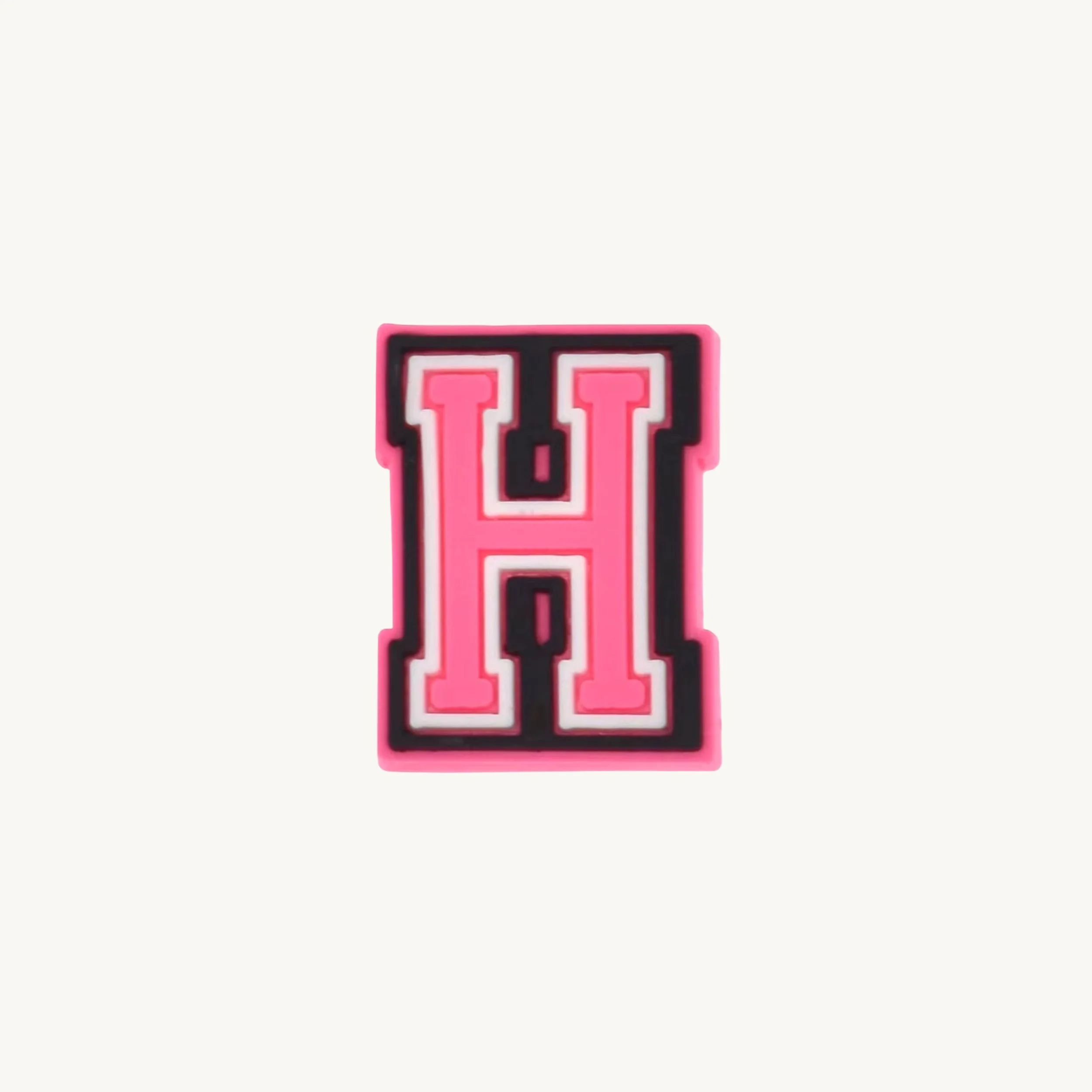 Pink varsity initial letter H charm by CharmyKidz for customizable hair accessories