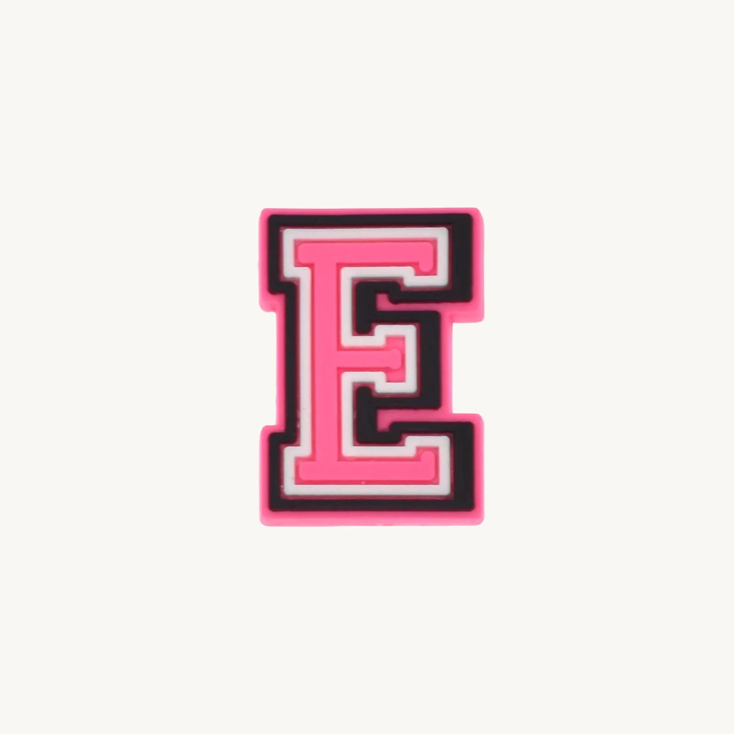 Pink varsity initial letter E charm by CharmyKidz for customizable hair accessories