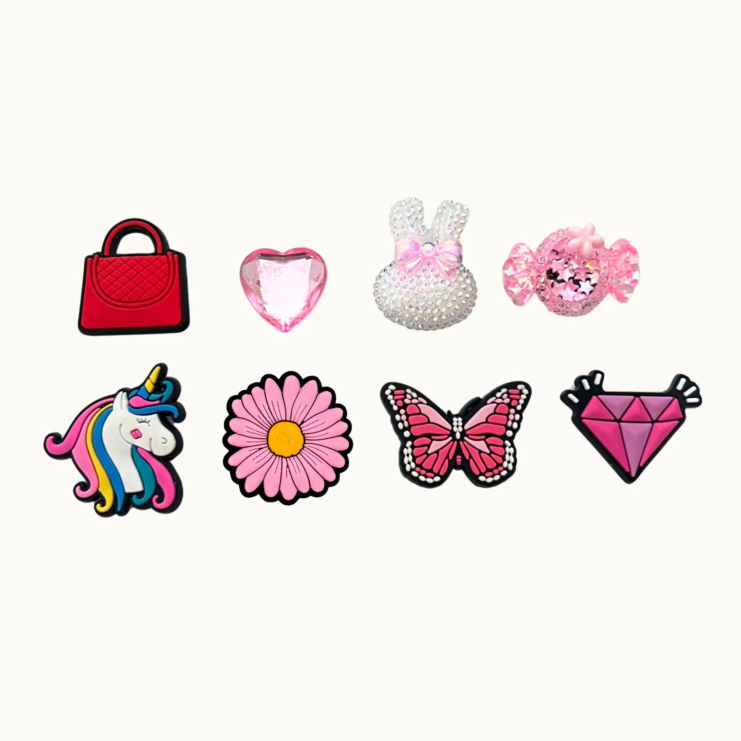 Red handbag, pink gem heart, sparkle bunny, candy, unicorn, daisy, butterfly, and diamond 8-pack charm set by CharmyKidz for customizable hair accessories