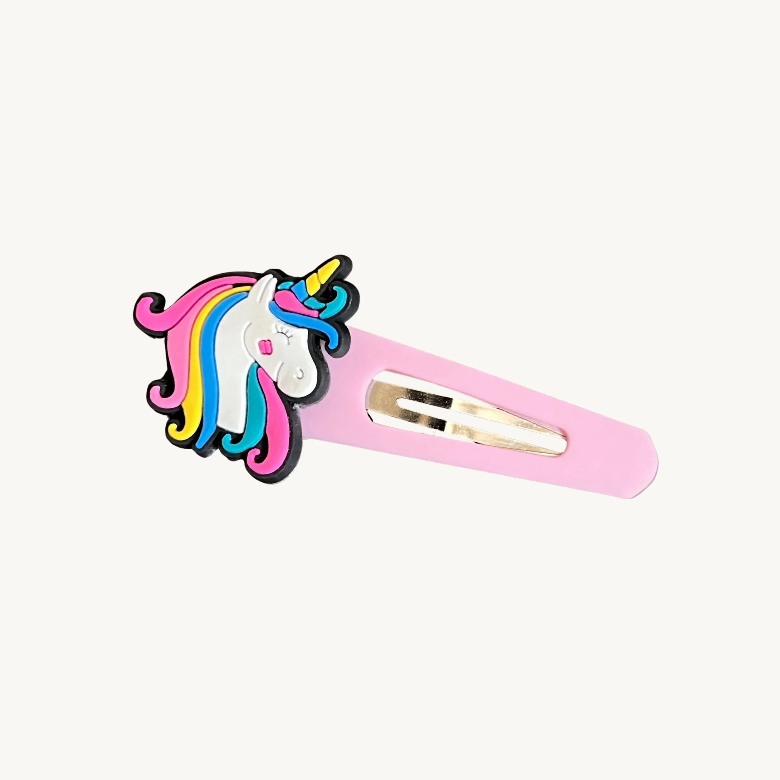 Light pink hair clip with rainbow unicorn charm by CharmyKidz for customizable hair accessories