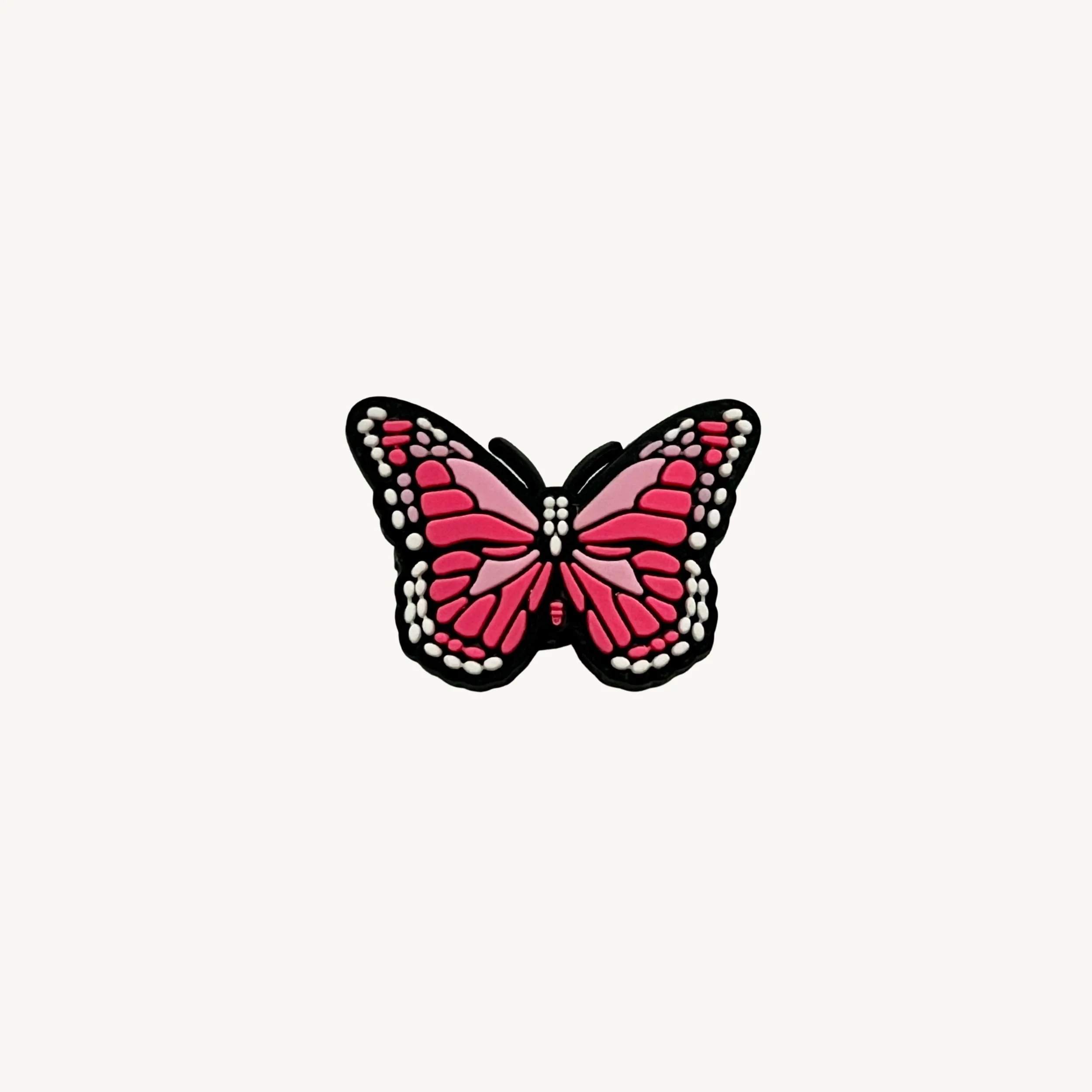 Bright pink butterfly charm by CharmyKidz for customizable hair accessories