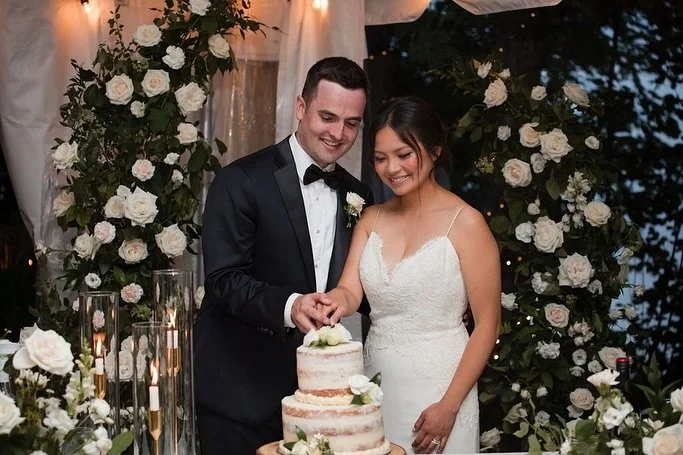 A sweet moment in the most romantic setting.  Surrounded by blooms, love, and laughter, A &amp; J shared their first slice of forever. 

Photography @flashbackphotography 

#GardenWedding #CakeCutting #torontoflorist #gardenstyleflorals #weddingflori