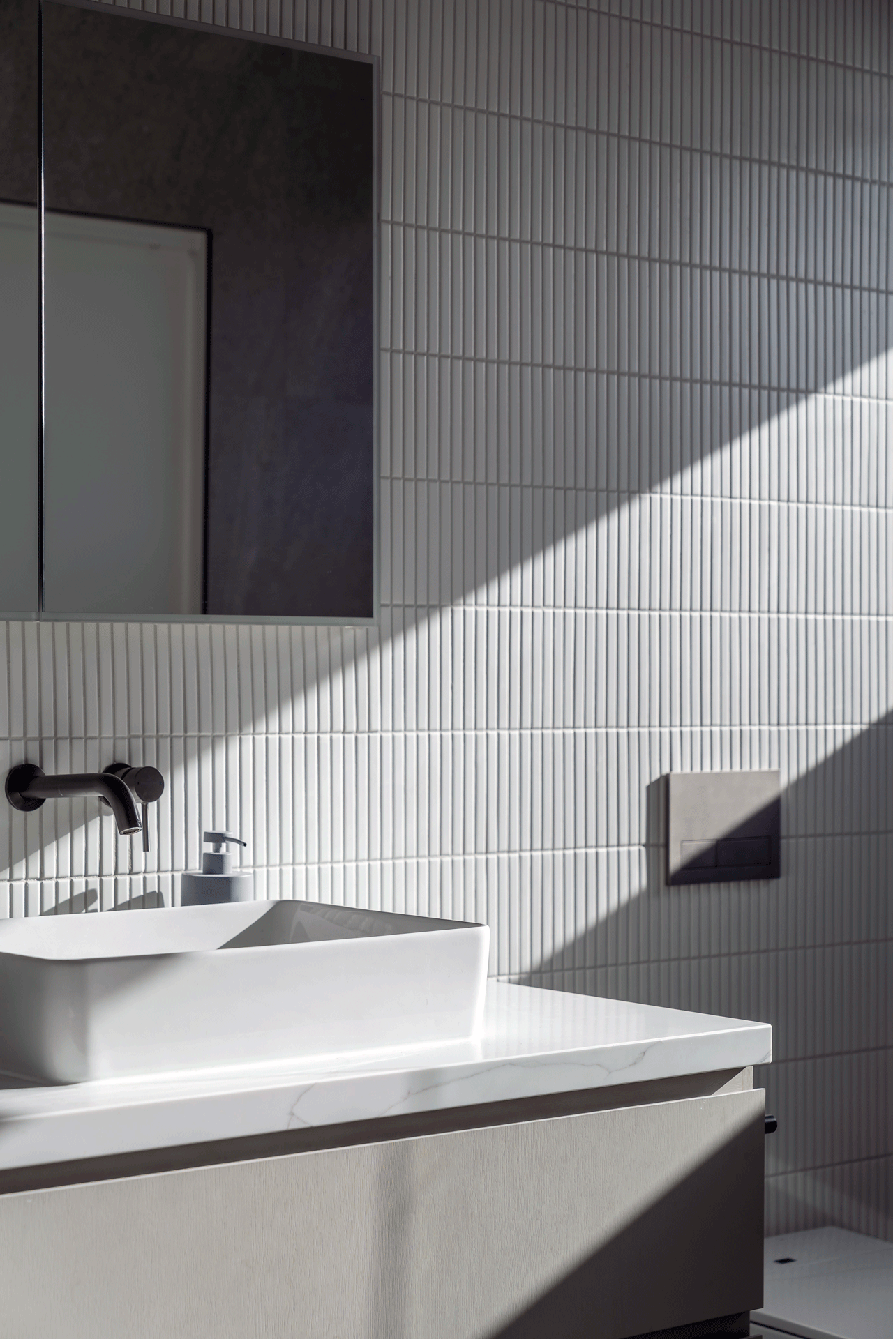 Thin, vertical subway tile in contemporary bathroombathroom