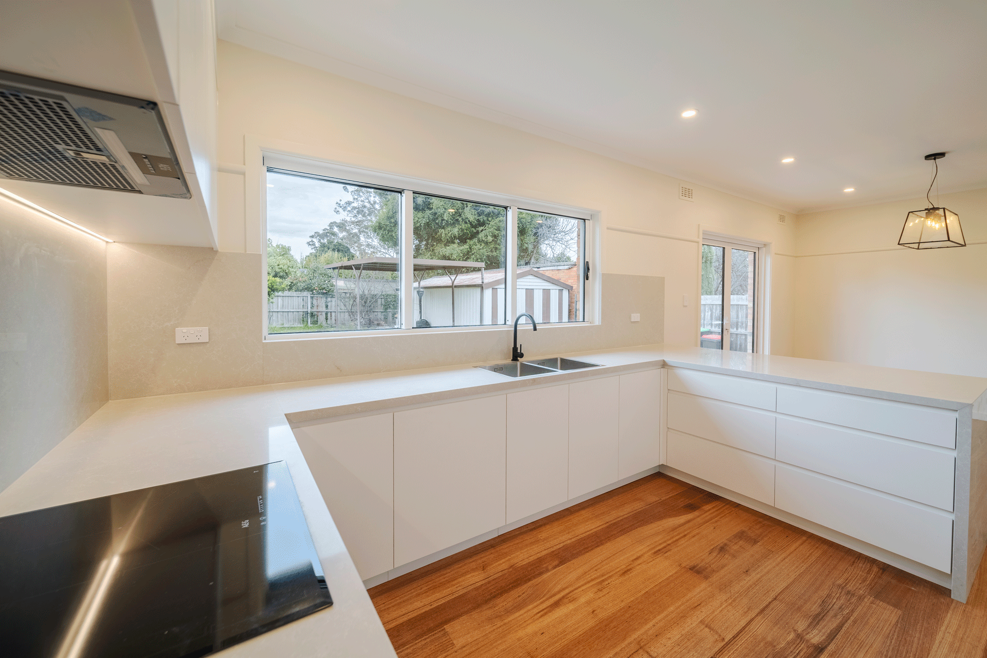 Clean kitchen renovation with white high quality finishes