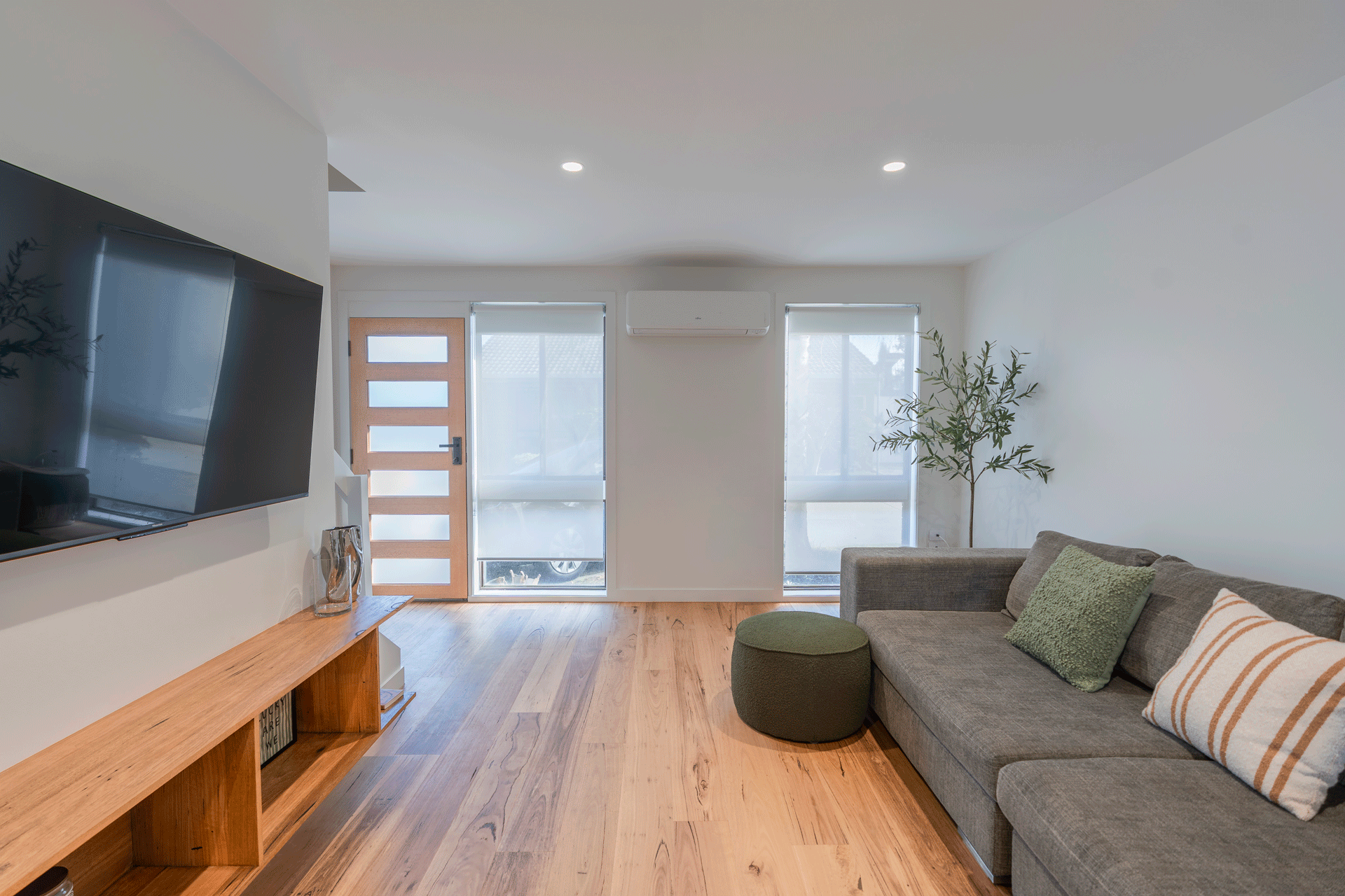 Timber floors and front door in modern renovation