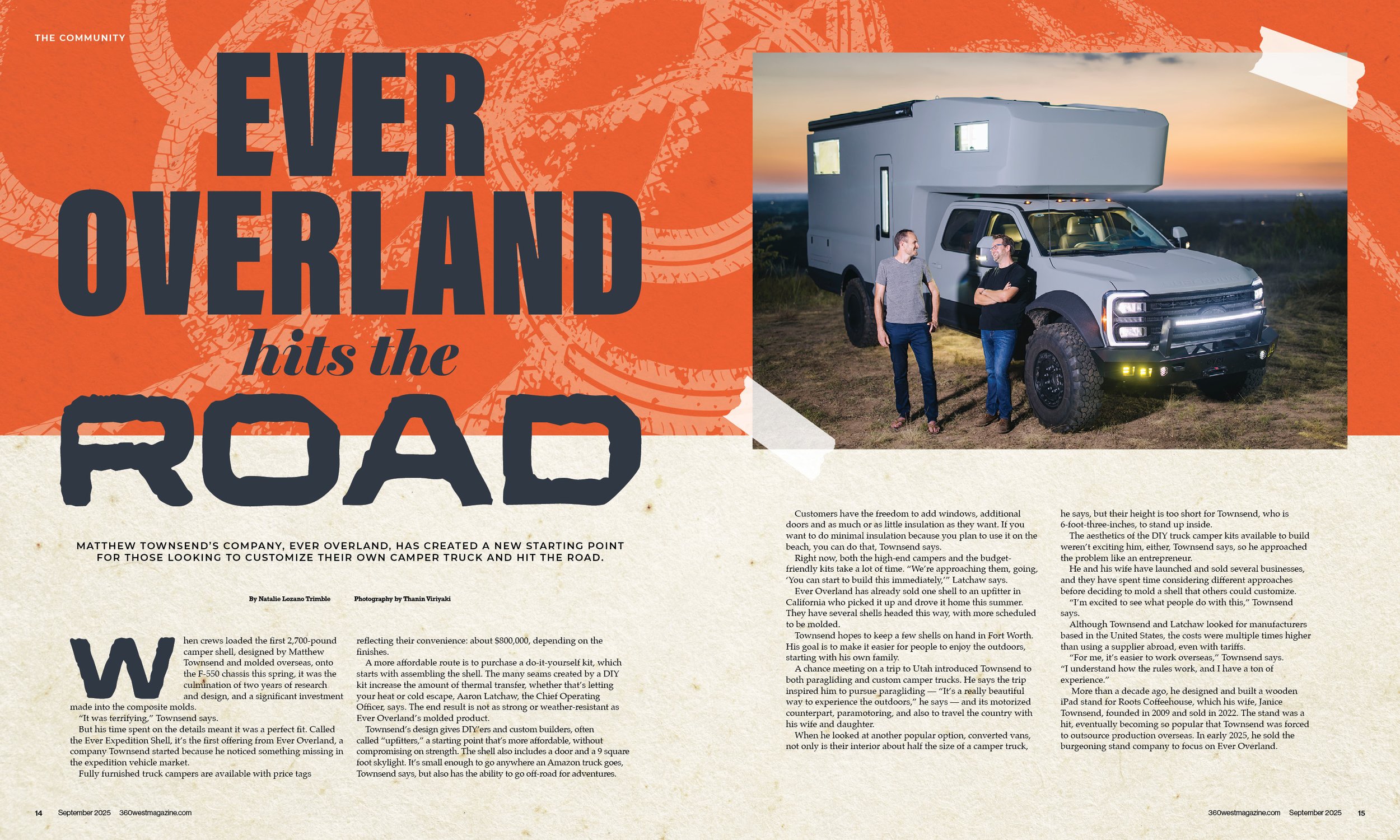 Two men talking next to a custom camper truck with a large, boxy living space on the back, parked outdoors during sunset.