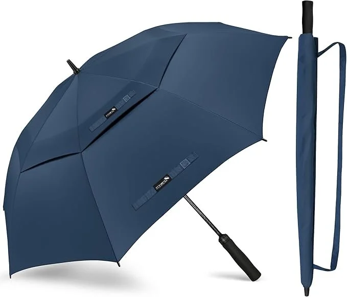 A blue compact travel umbrella with a coordinating sleeve and handle, shown in an open position.