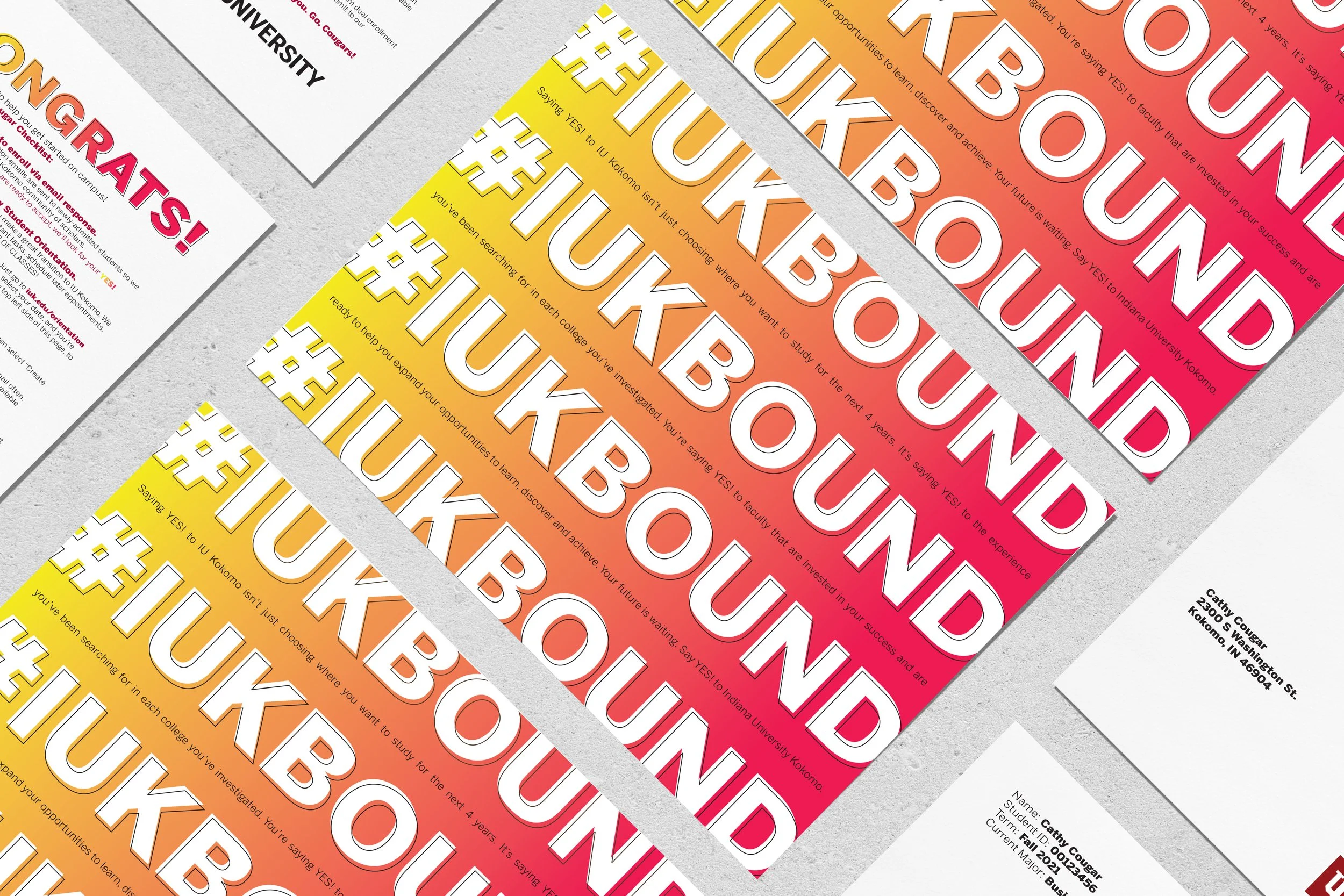 mockup of several sheets of paper with the words #IUKBOUND over a colorful gradient