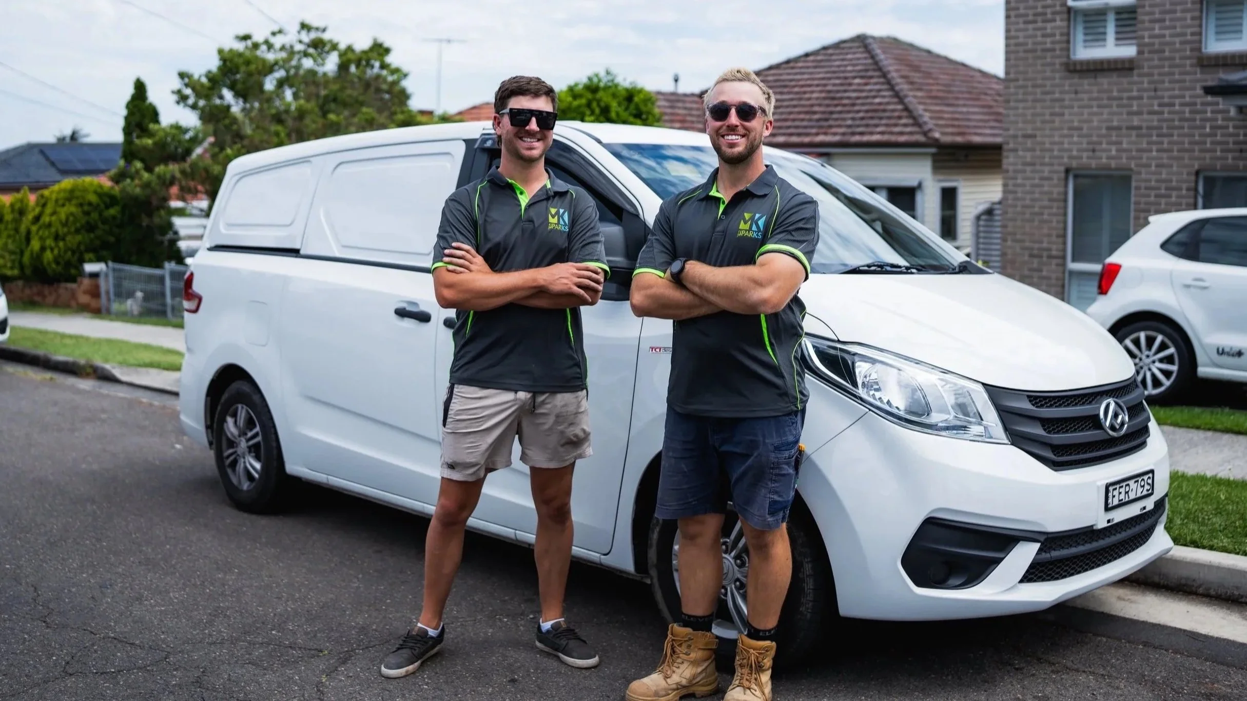 MK Sparks Electricans Standing infront of work van