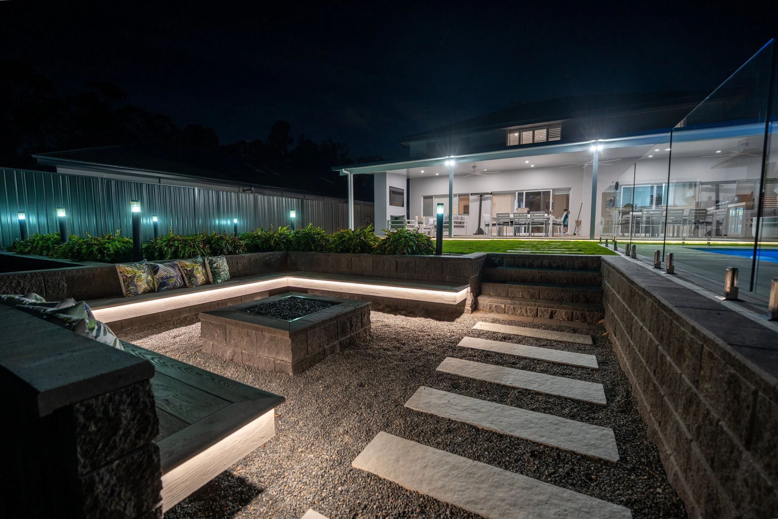 Outdoor lighting by a fire pit.