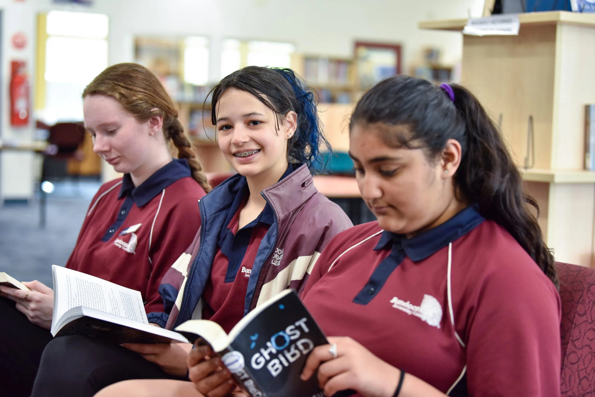 3 students reading.jpg