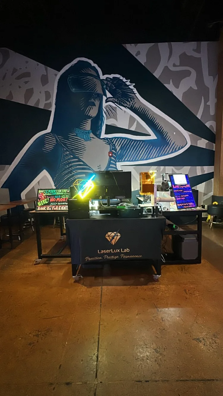 LaserLux Lab engraving booth at an event