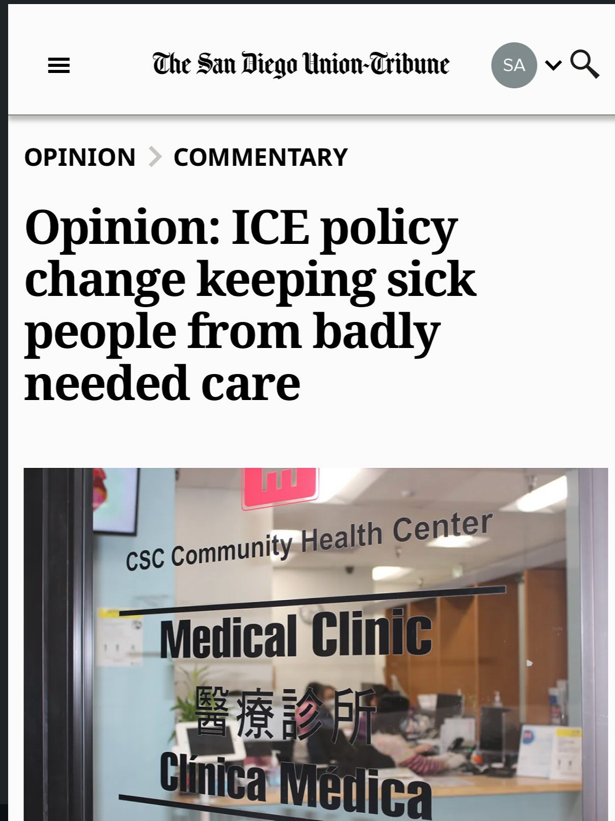 A screenshot of a news article from the San Diego Union-Tribune with the headline about ICE policy and healthcare for sick people. Below the headline is a photo of a community health center with signs in English, Chinese, and French indicating it's a medical clinic.