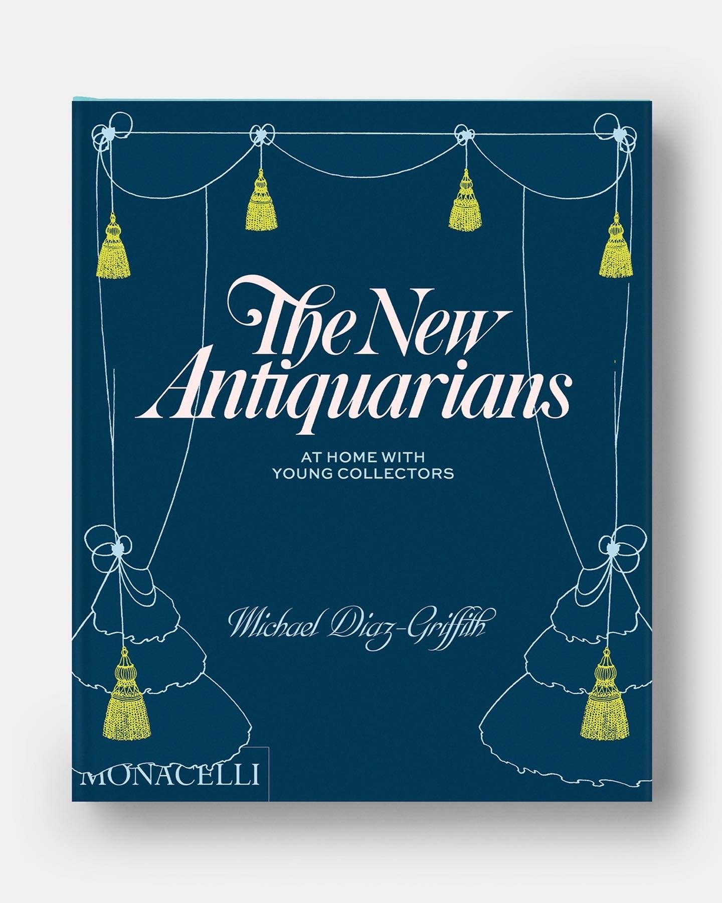 Cover of "The New Antiquarians: At Home with Young Collectors" by Michael Diaz-Griffith featuring a dark-blue and chartreuse jacket showing a tasseled pair of parted curtains.