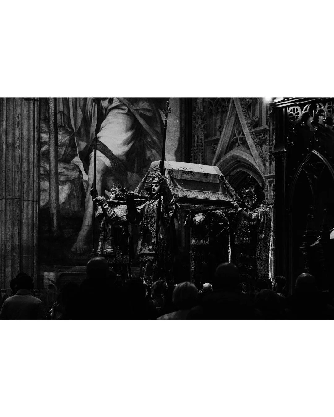 History held high. The tomb of Christopher Columbus stands in the shadows of the cathedral, a massive bronze monument carried by the four kings of Spain. It is a somber, heavy corner of the building where the light barely touches the surface.

La his