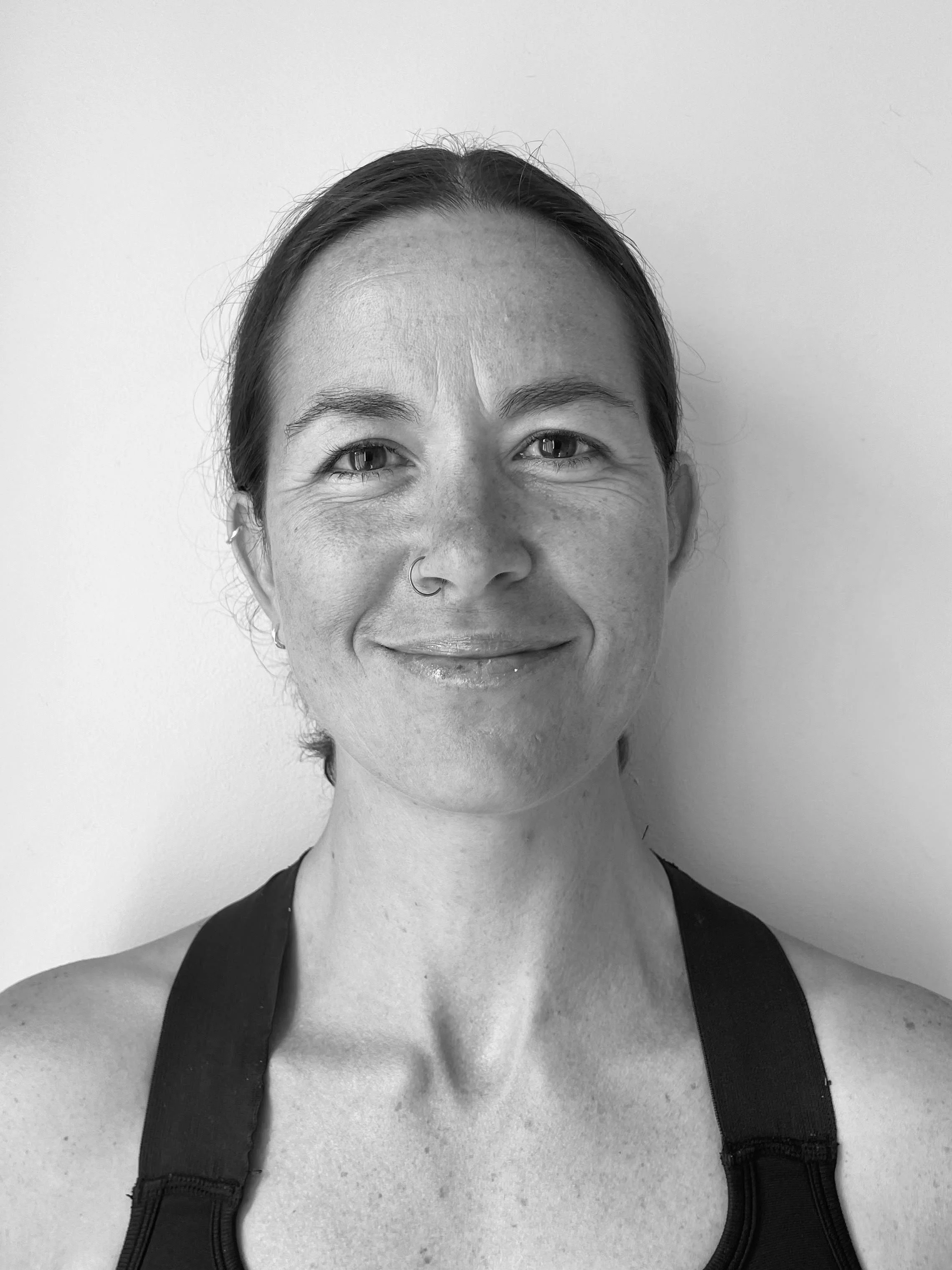 Black and white photo of a smiling woman