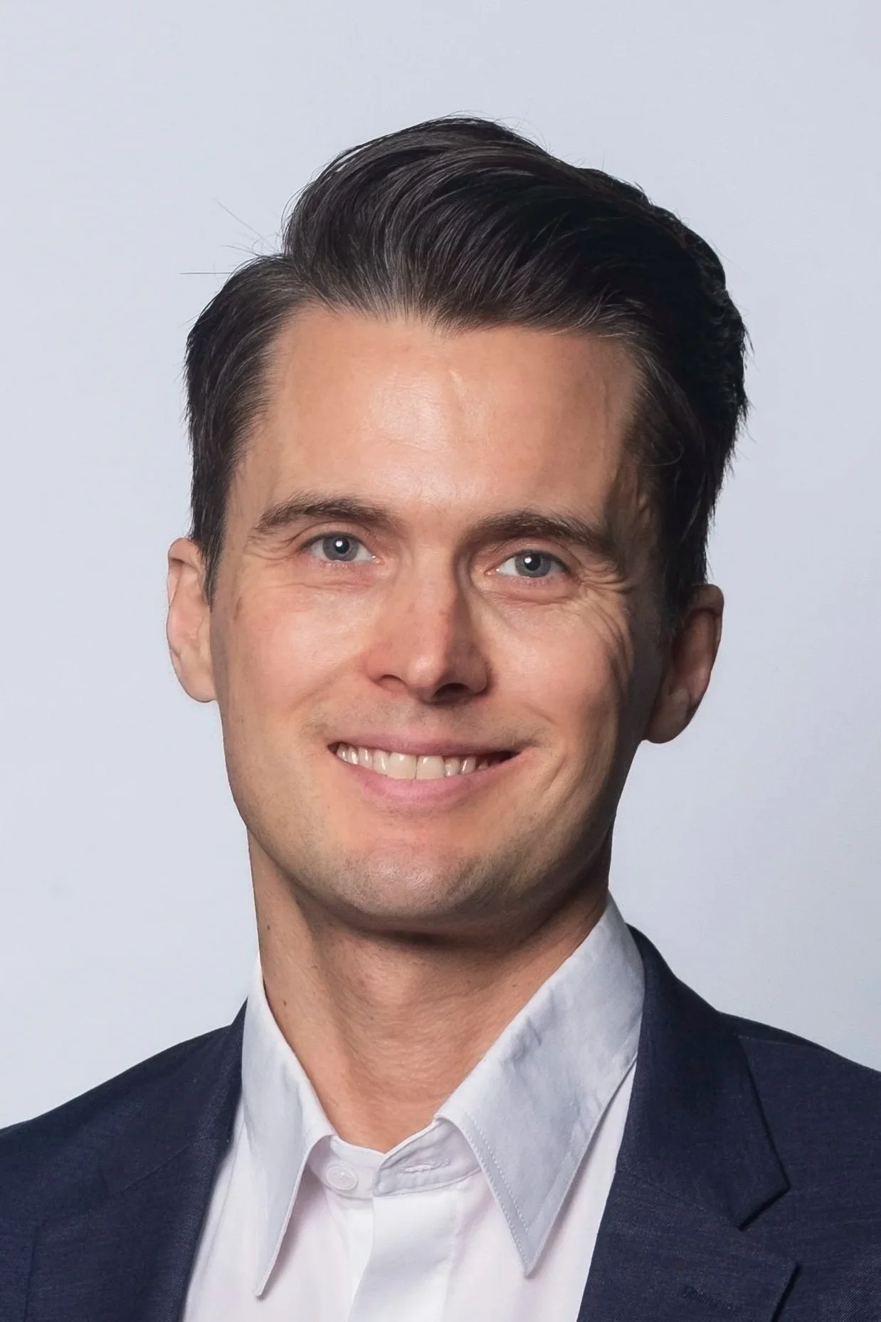 A man with short dark hair.