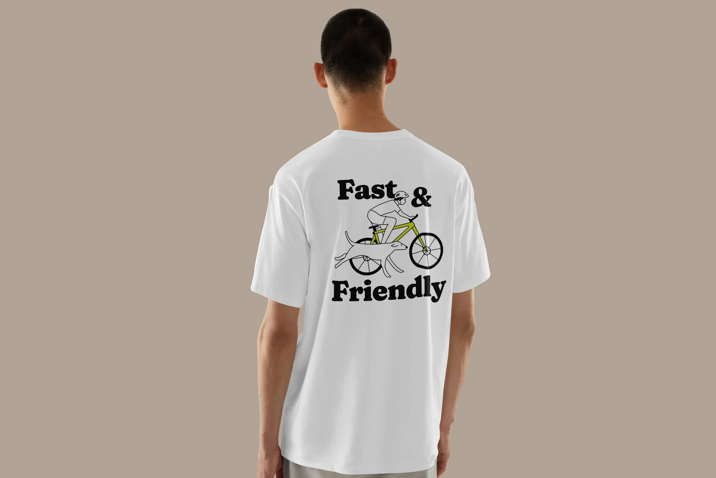 Back view of a person wearing a white T-shirt with a graphic of a person riding a bicycle on it, and the words 'Fast & Friendly' printed around the graphic.