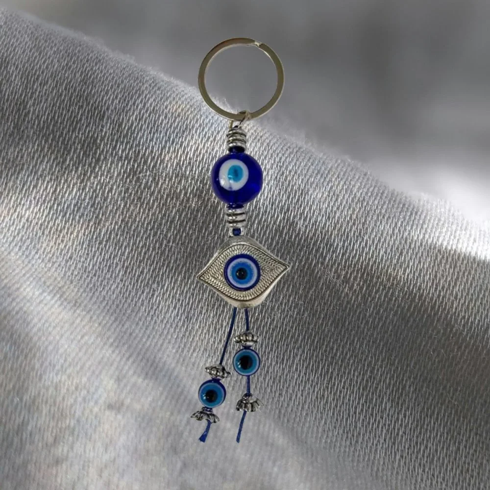 🧿✨ Evil Eye Keychain – Spin Top Charm