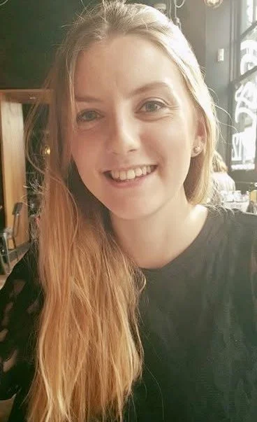 Orange background with a blue outline smiley face.