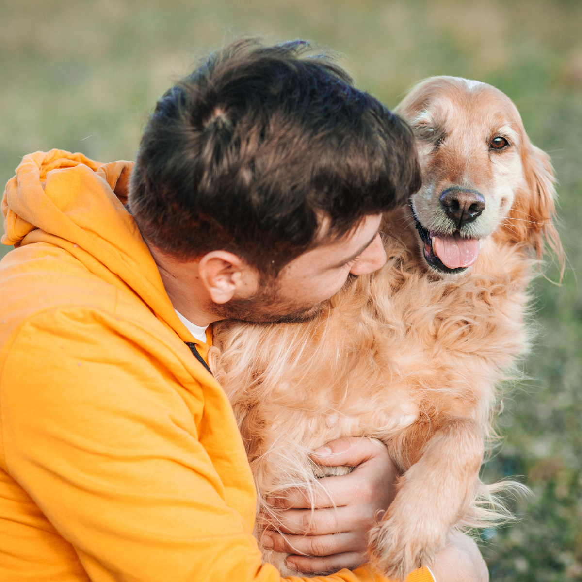 A man hugging his dog