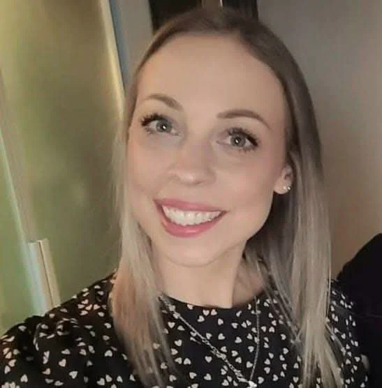 Danielle smiling at the camera 