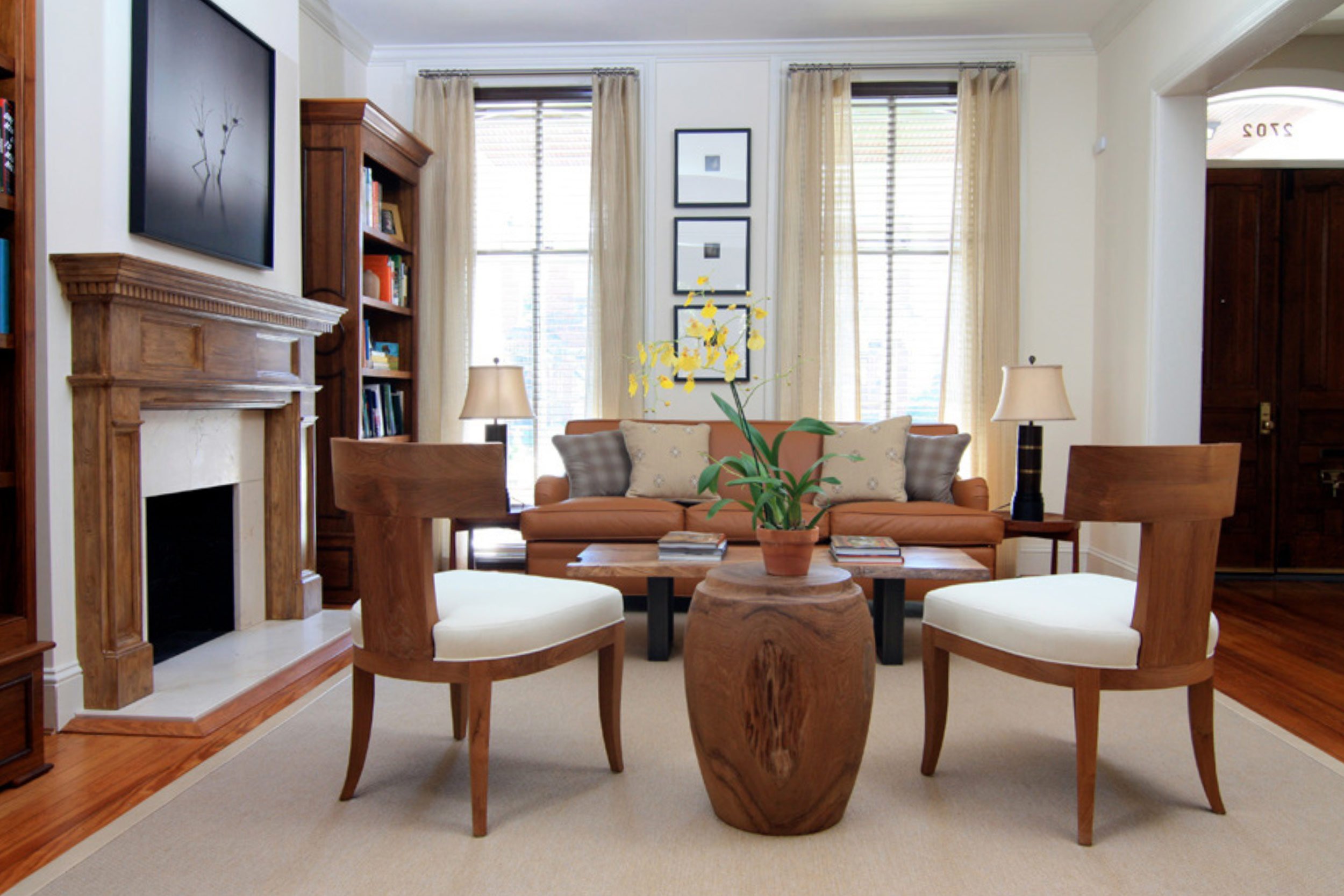 A view of a living room in a neutral color scheme.