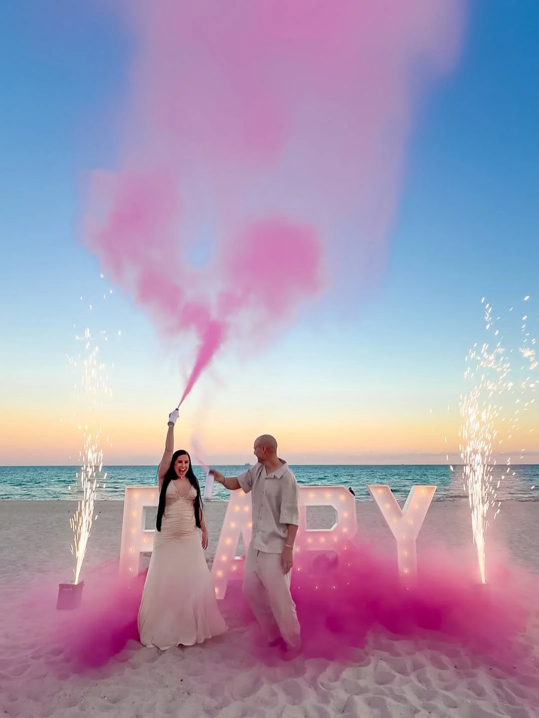 High pressure gender reveal smoke cannon array with bespoke balloon styling.