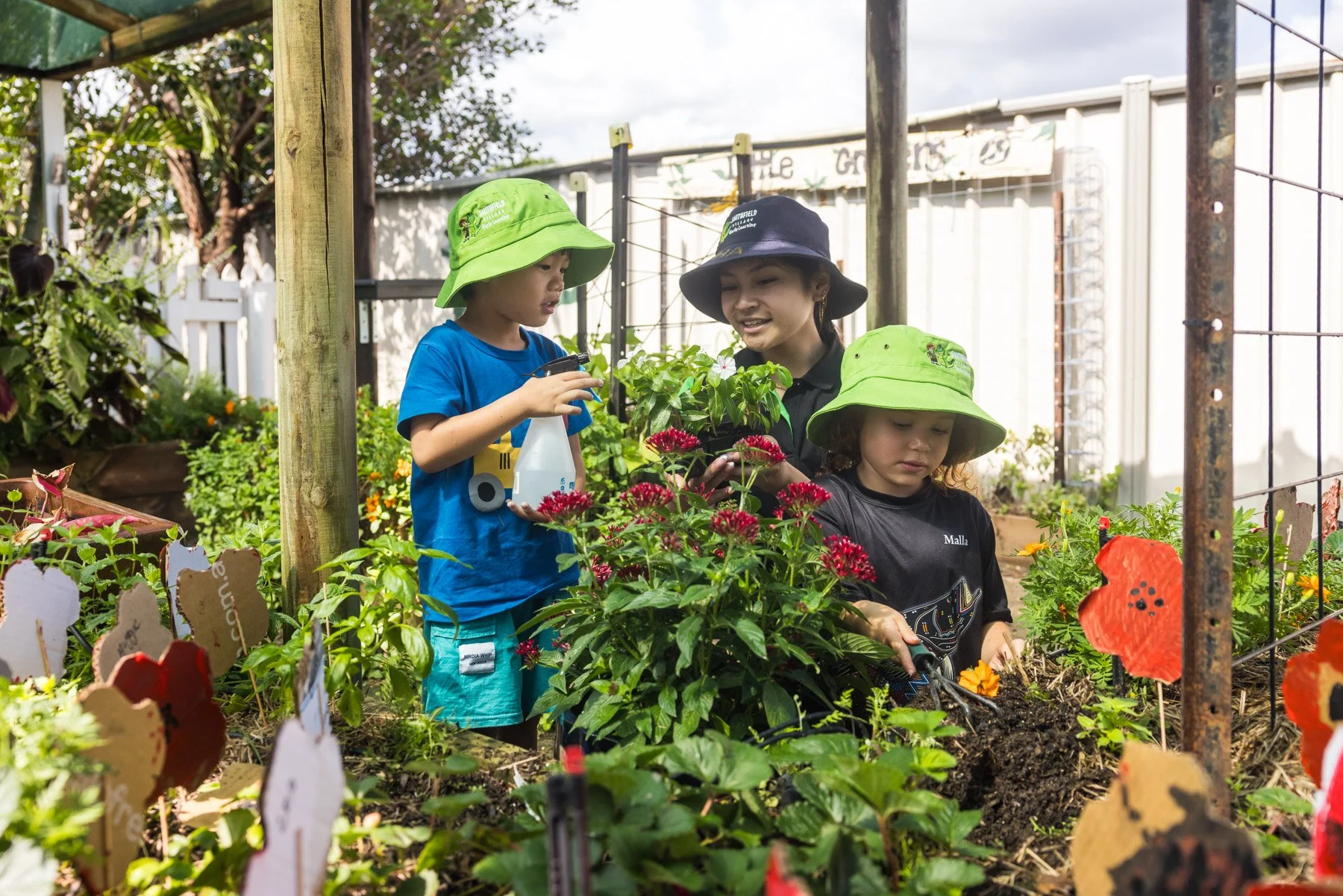 a happy toddler riding a bike