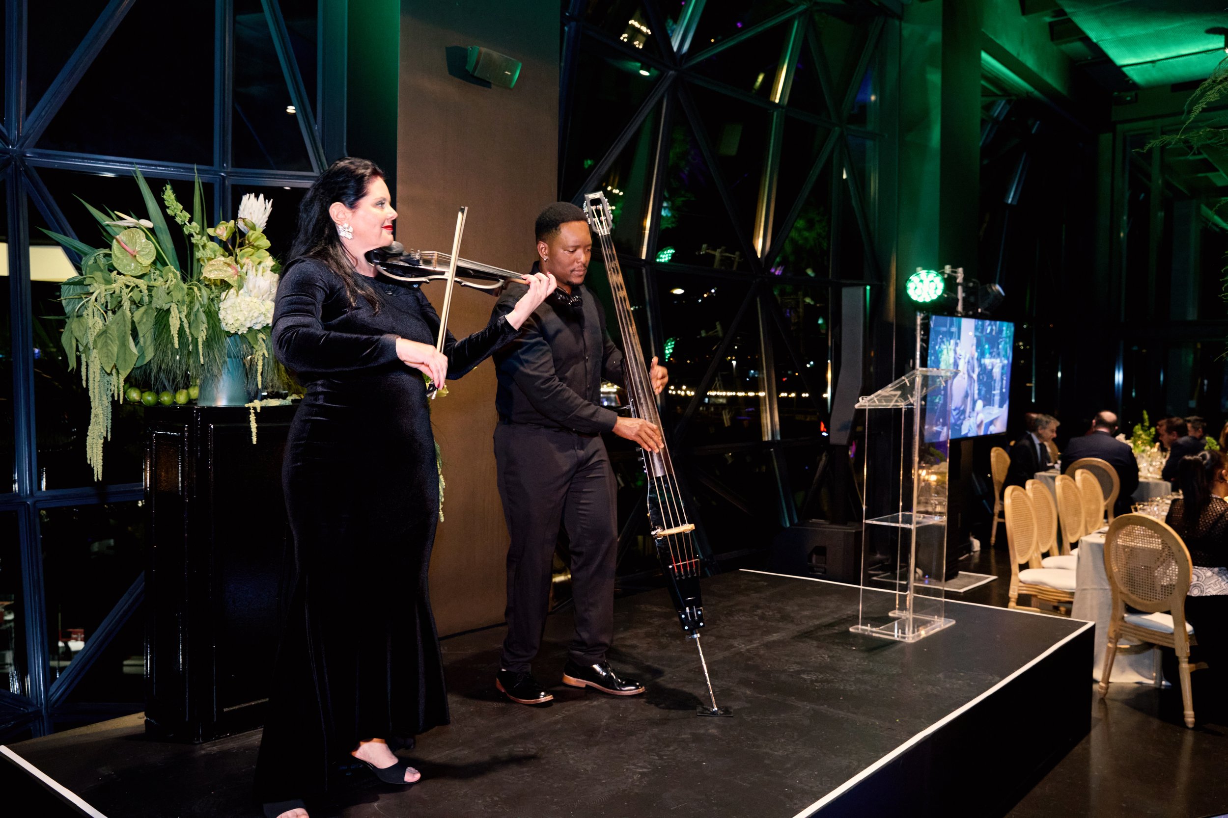 Cape Town Flo live entertainment duo performing with electric violin and electric upright bass on stage at a luxury corporate event in Zeitz MOCAA, Cape Town.