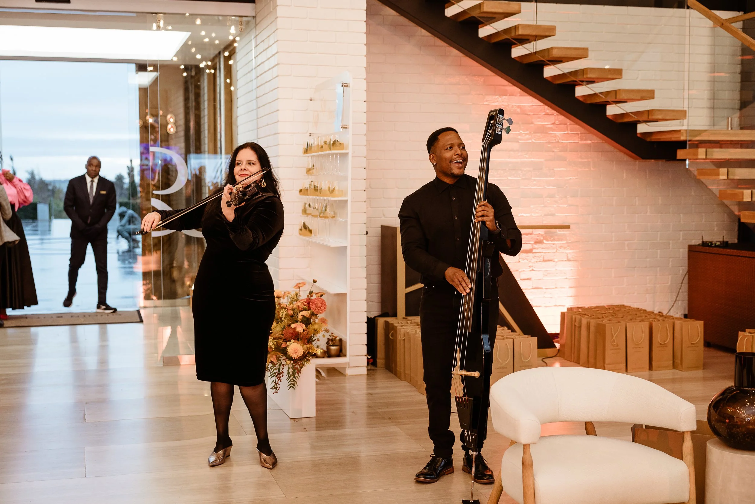Cape Town Flo performing electric violin and electric bass at Quoin Rock Wine Estate during a luxury corporate event in Stellenbosch.