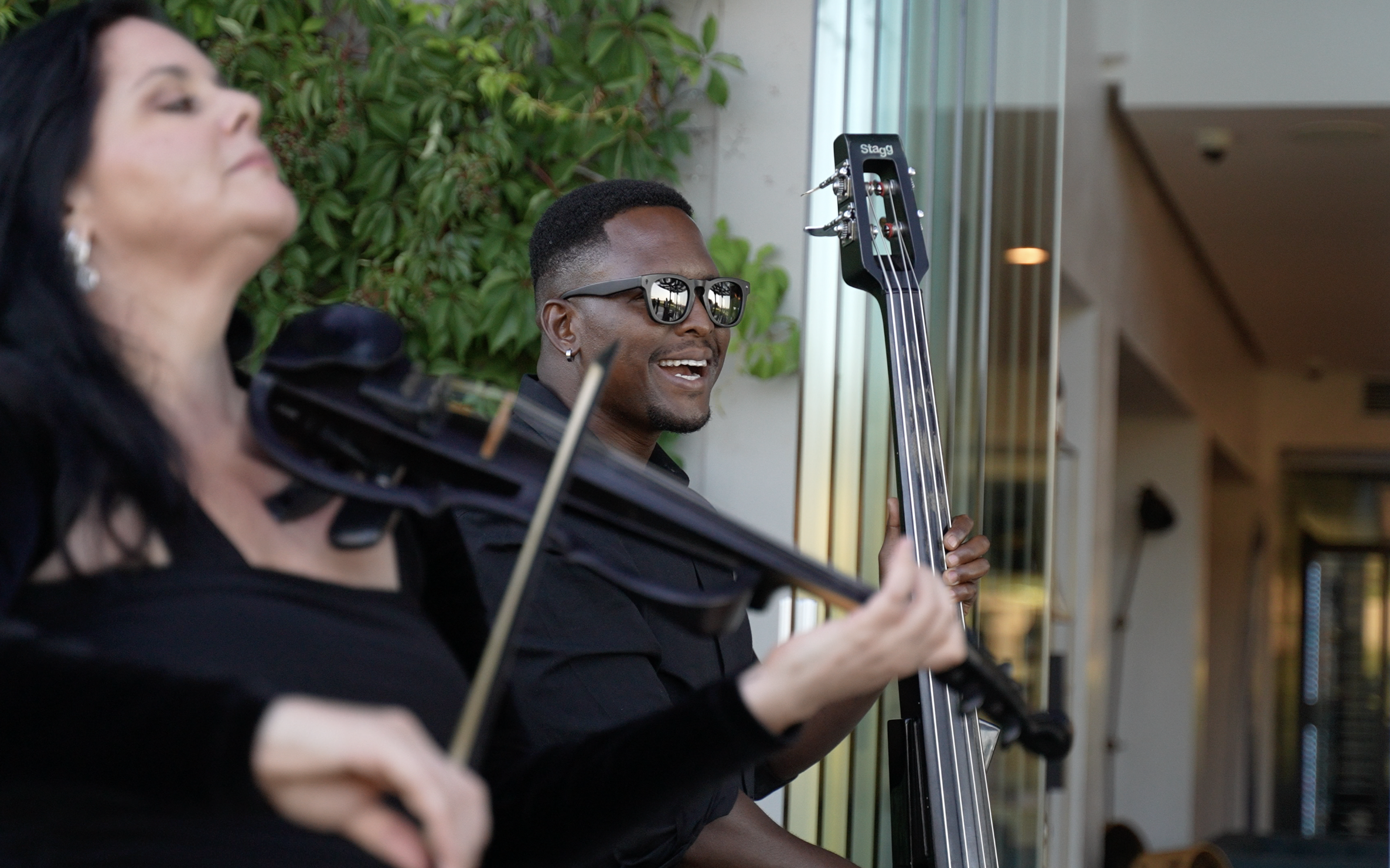 Cape Town Flo entertaining Standard Bank executives at Quoin Rock. The duo's blend of electric violin, bass and African-inspired arrangements provides live music for conferences, gala dinners and corporate gatherings.